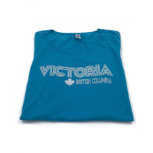 Load image into Gallery viewer, blue women&#39;s Victoria t-shirt folded
